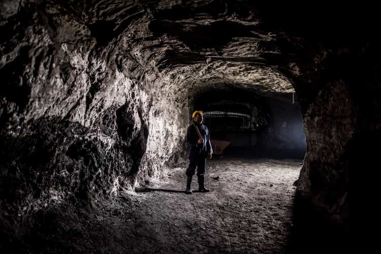 Miner working at a mine underground