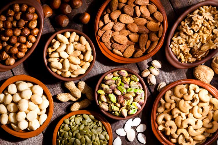 Nuts assortment on rustic wood table.