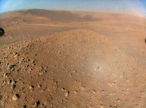 NASA's experimental helicopter Ingenuity snapped this Martian vista from 40 feet up in the air.