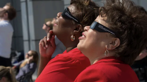 NASA employees watching an eclipse with eclipse glasses.