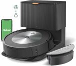 Roomba on self emptying dock with external water tank and smartphone with green iRobot screen