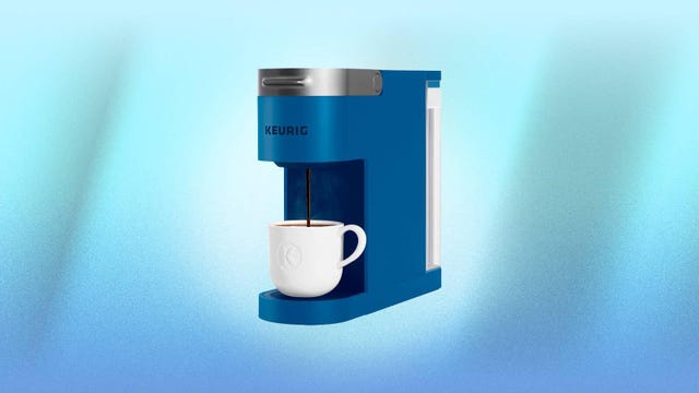 A blue Keurig K-Slim brewer against a blue background.