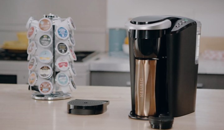 Keurig K-Compact coffee maker alongside coffee pods.