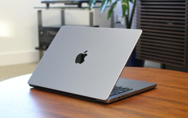 The MacBook Pro on a wooden table.