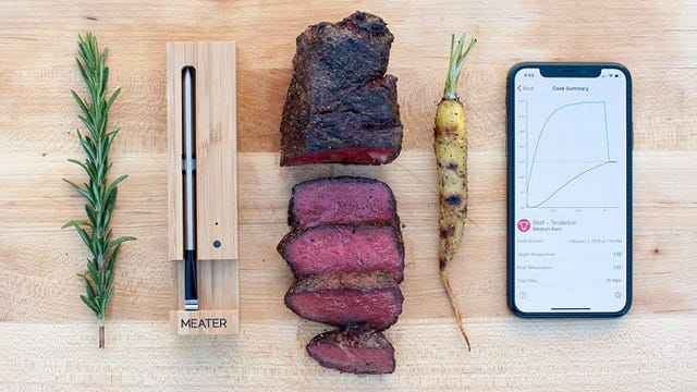 meater probe next to a medium rare steak and an iPhone