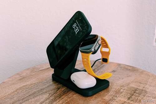 Nomad Stand One Max with an iPhone tilted, bumping into an Apple Watch 