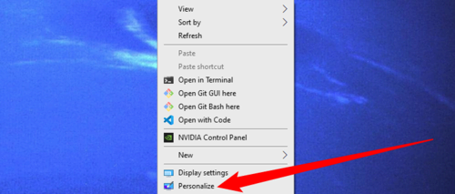 Right-click empty space on your desktop, then select 'Personalize.'