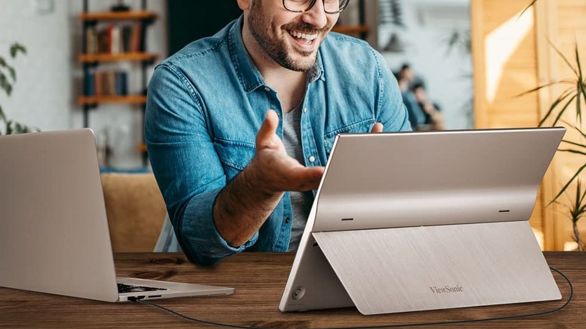 Person talking with a ViewSonic portable monitor