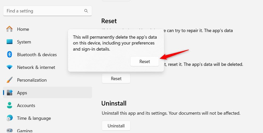 Windows 11 Notepad Reset warning pop-up window highlighting Reset button.