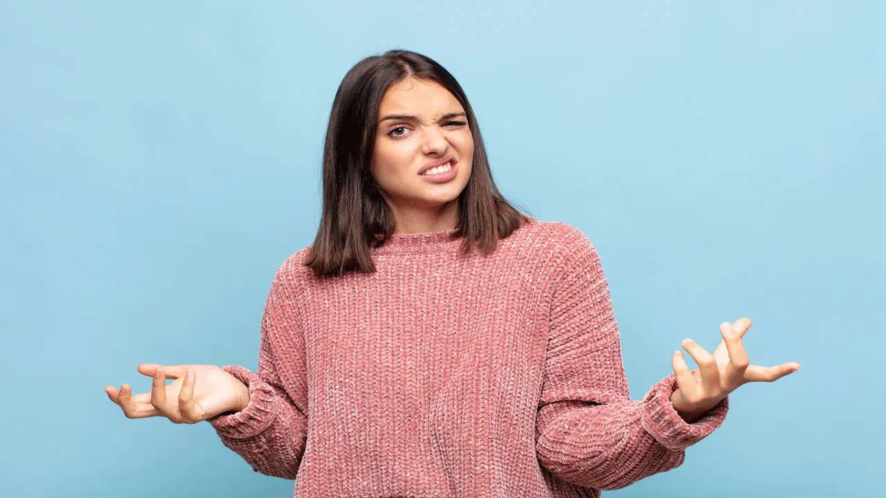 young woman shrugging