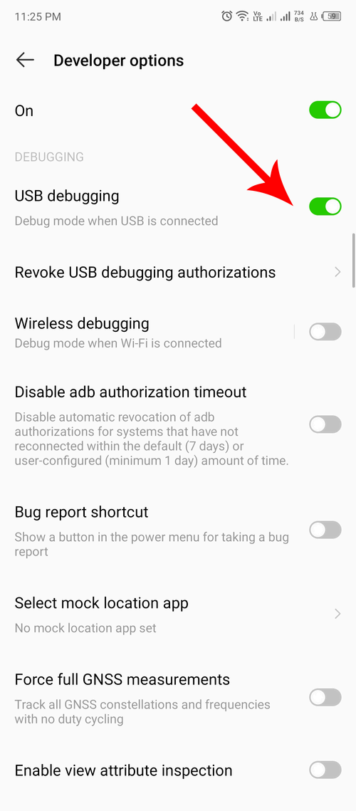 A red arrow pointing at the USB debugging toggle in developer options.