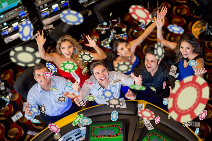 Casino players throwing chips in the air.