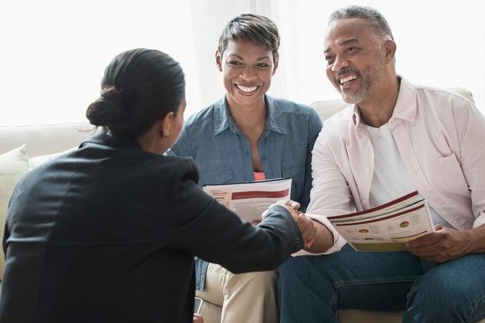 Professional woman meeting with clients.