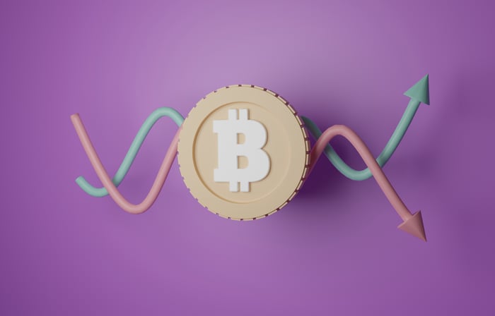 A graphic showing up and down arrows with a Bitcoin logo.