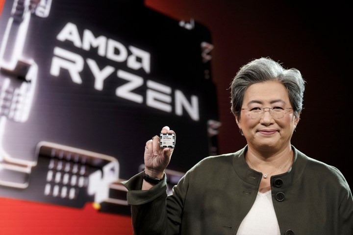 AMD CEO holding a Ryzen 7000 processor.