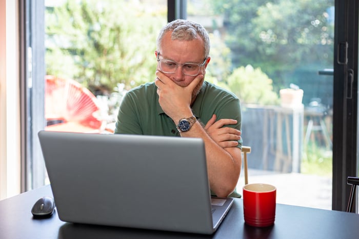 A person at a laptop.