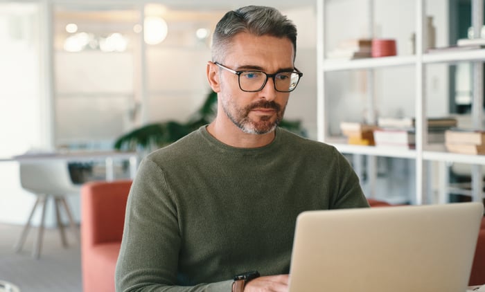 A person at a laptop.