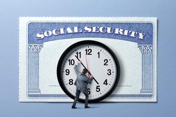 Graphic of someone adjusting a clock in front of a Social Security card.