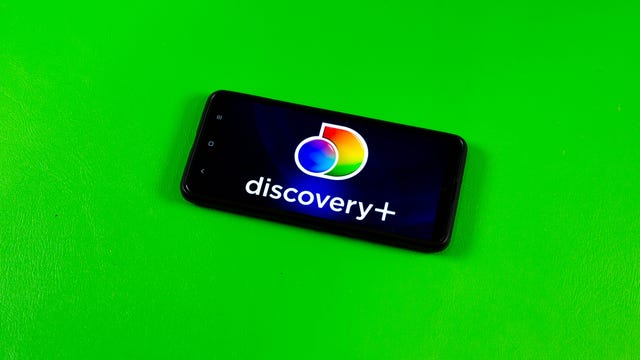 Discovery Plus logo on a phone