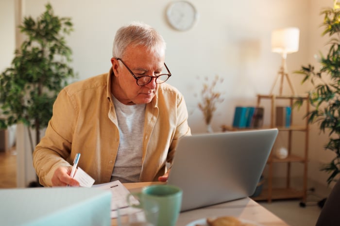 A person at a laptop.