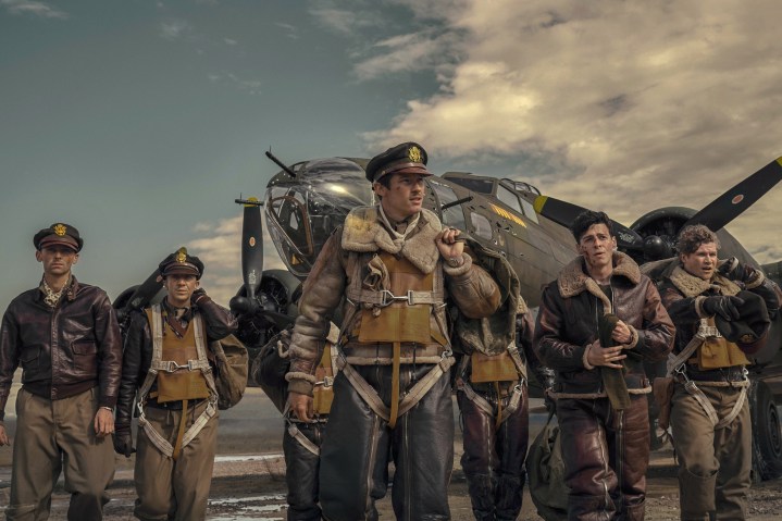 Callum Turner stands with a group of pilots in Masters of the Air.