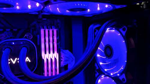 A liquid cooler with purple lights around it. 