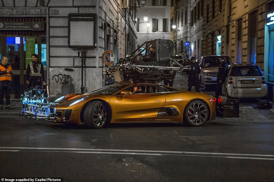 One was even converted into a 'pod car' (pictured), with a seat and all driving controls encased in a roll cage mounted on the roof so stunt drivers can manoeuver the vehicle during scenes with Spectre henchman, Mr Hinx, played by actor Dave Bautista, filmed sitting in the car