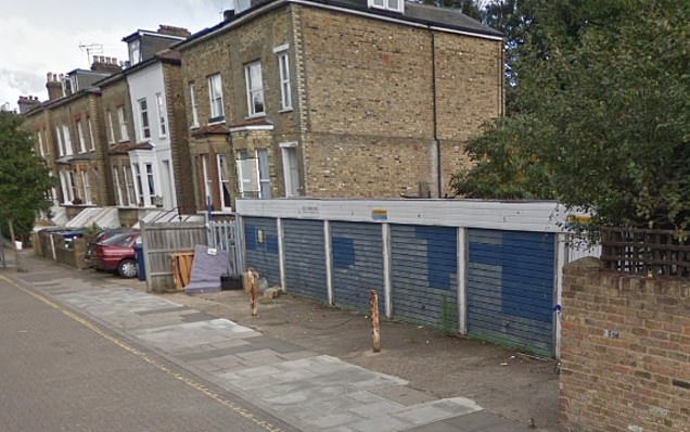 A row of old garages before being replaced with a new house