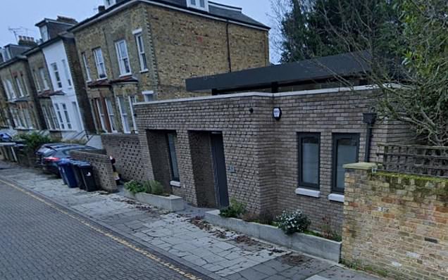 A row of old garages after being replaced with a new house