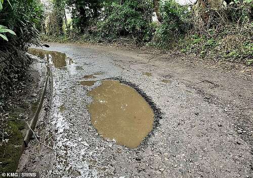 Eric said the roads where he lives are in a poorer state than ever, with 'potholes the worst they have ever been'. Pictured: One of the potholes in the village of West Hougham, Kent