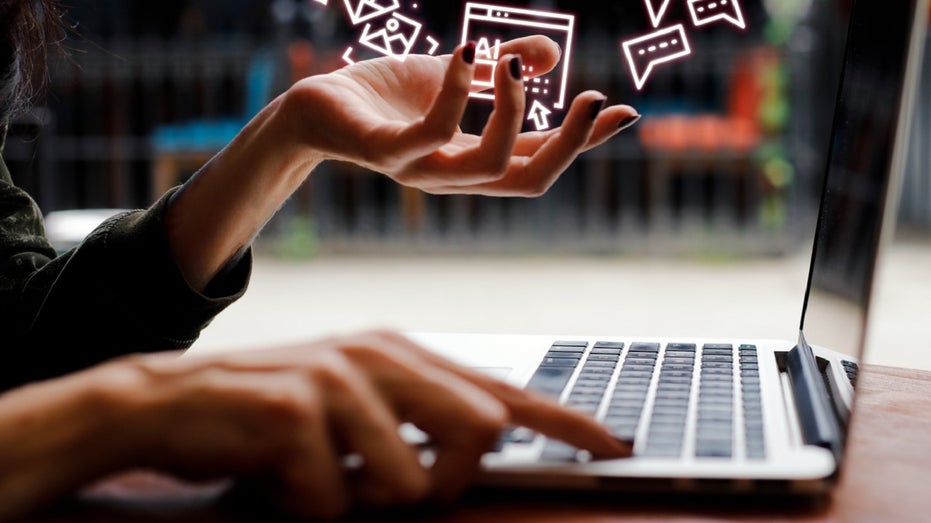 woman typing holding AI symbols