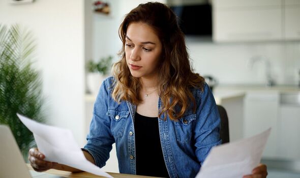 A woman checks her bills