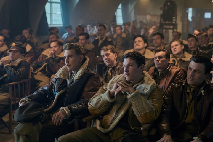 Austin Butler and Callum Turner sit with other pilots in Masters of the Air.