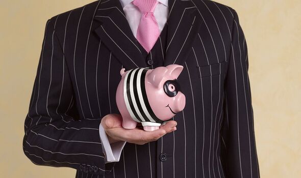 Banker/financial advisor with burglar piggy bank landscape.