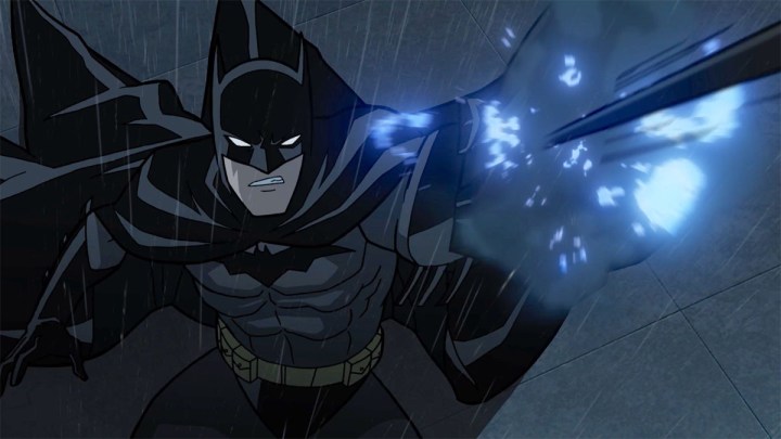 Batman fires a grappling gun in Batman: The Long Halloween.