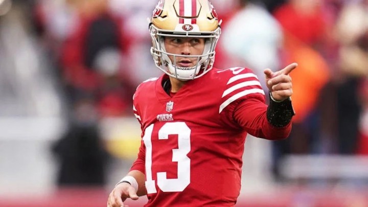 A football player points during a game.