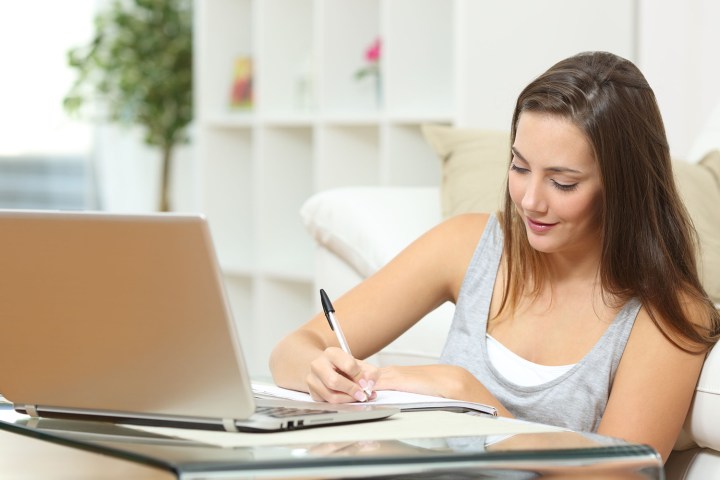 Woman taking lessons on Coursera online learning platform.