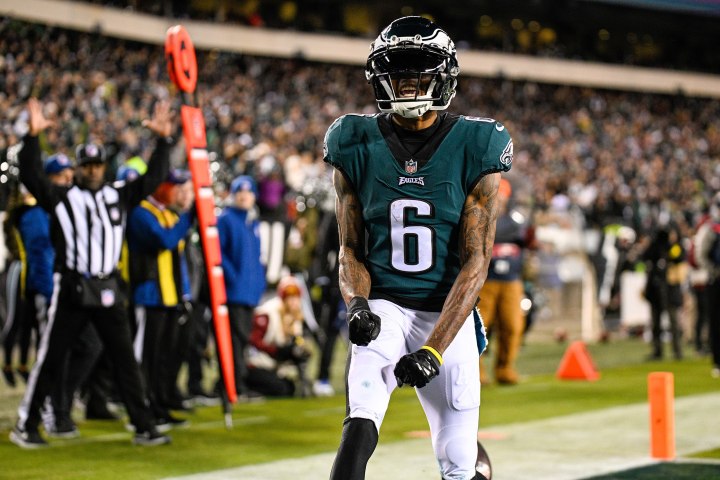 DeVonta Smith of the Philadelphia Eagles flexes in the end zone.