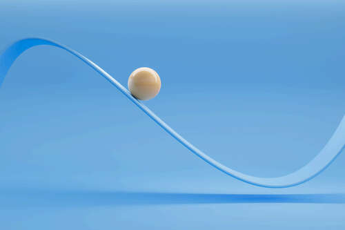 Image of a glossy white ceramic ball moving along an oscillating curve against a blue background.