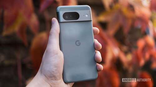 Google Pixel 8 back in hand red background