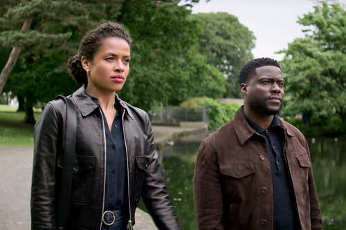 Gugu Mbatha-Raw and Kevin Hart walk together in Lift.