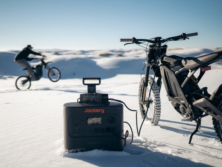 Explorers using Jackery Solar Generator Pro while skiing and snow-riding.