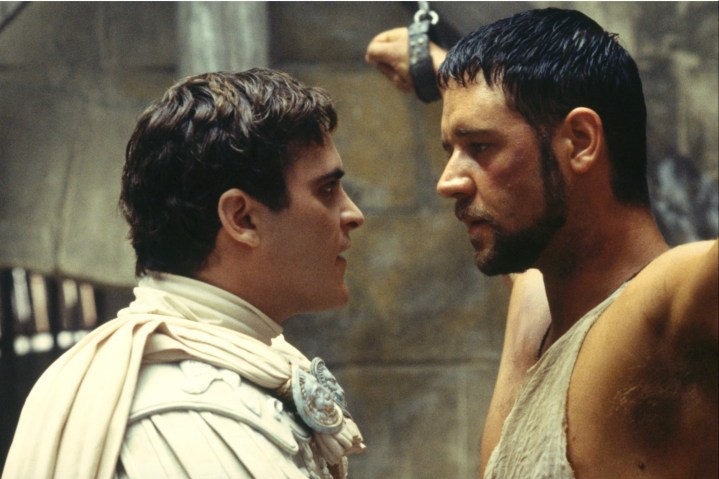 Joaquin Phoenix stares into Russell Crowe's eyes as the latter is chained.