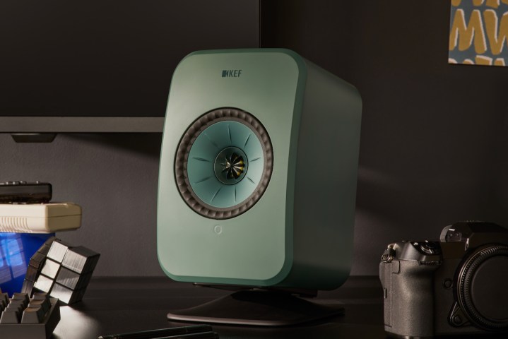 A single sage green KEF LSX II LT wireless speaker.