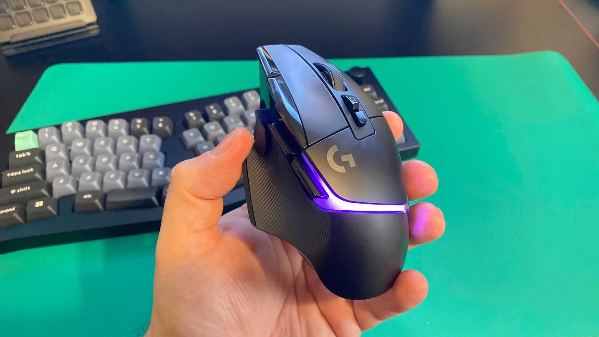 Logitech G502 X Plus mouse with green lighting.