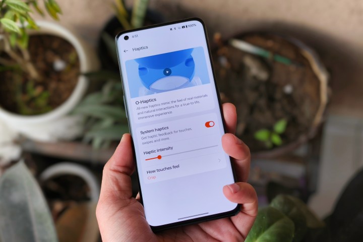 O-Haptics settings on OnePlus 11 held in hand.