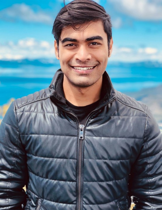 Convai founder Purnendu Mukherjee stands against a skyline.