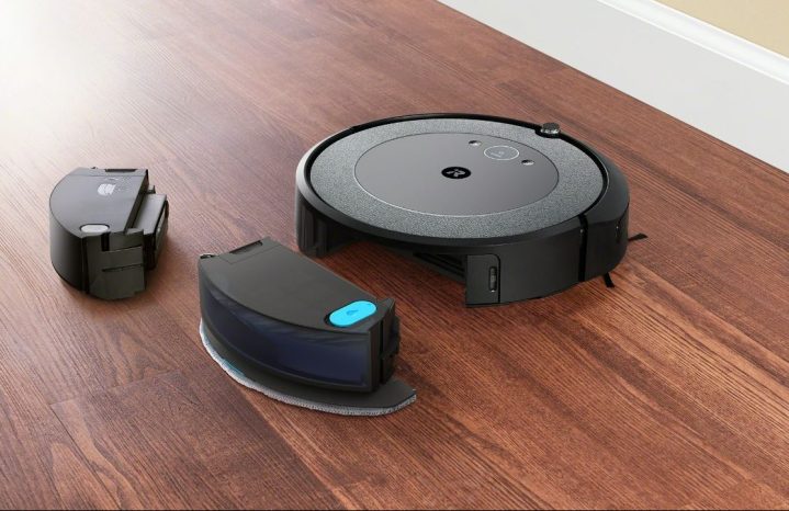 The Roomba Combo i5+ next to its different bins.