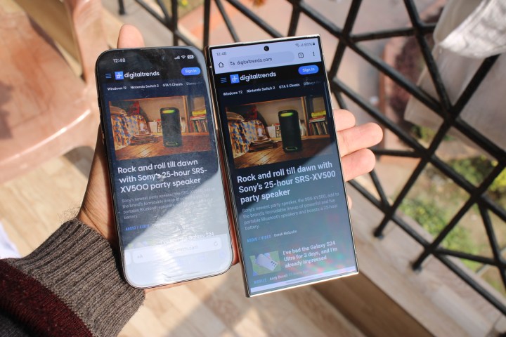 iPhone 15 Pro and Galaxy S24 Ultra in hand with screen on to show better anti-reflectivity of the S24 Ultra.