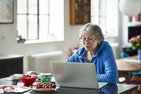 A woman checks her finances